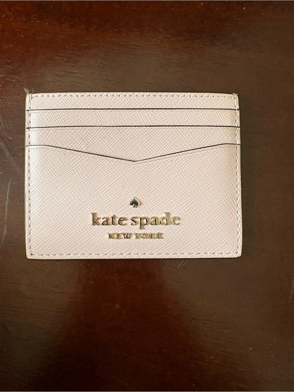 kate spade pale pink saffiano card holder with gold logo